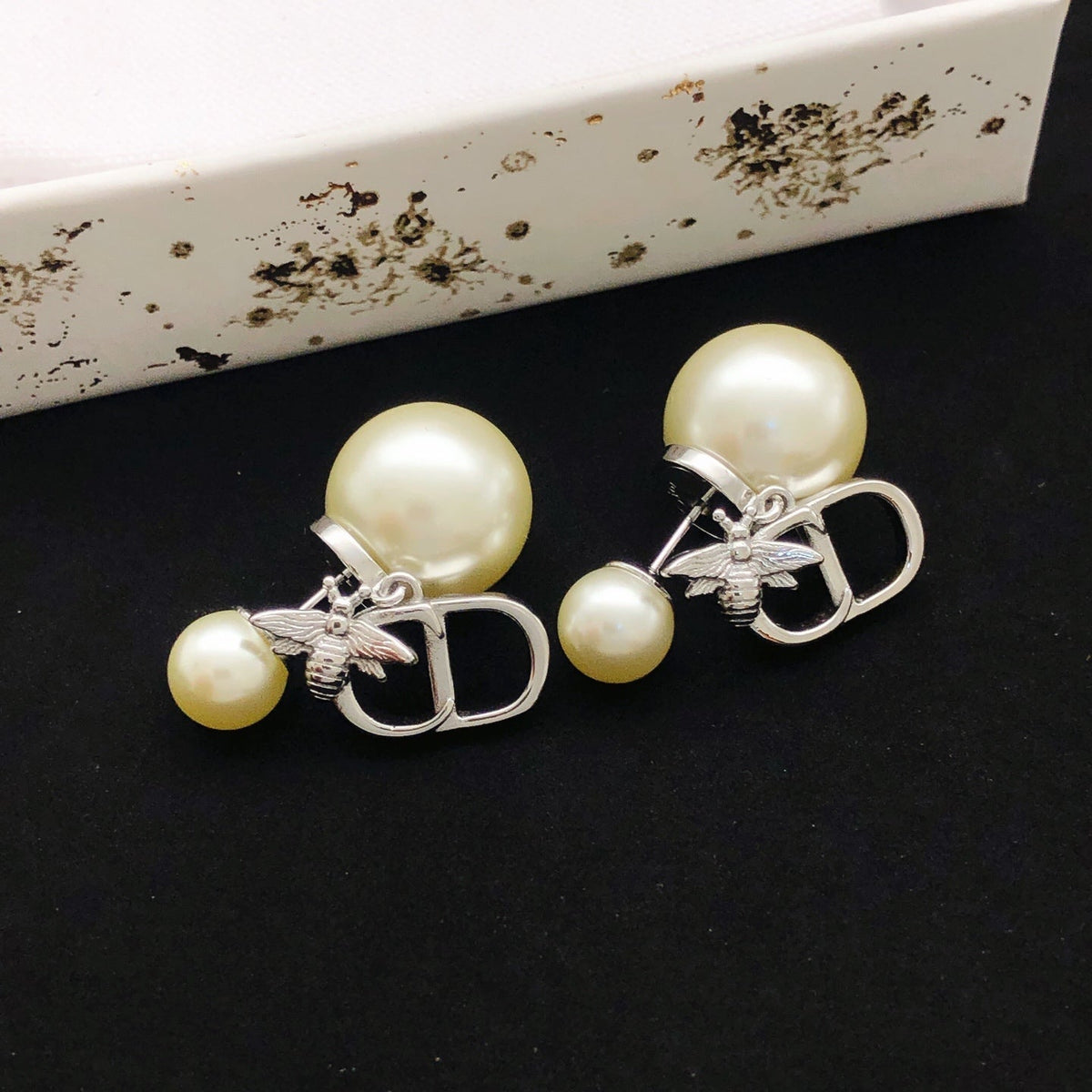 Martin Graham stud earrings in polished metal-tone
