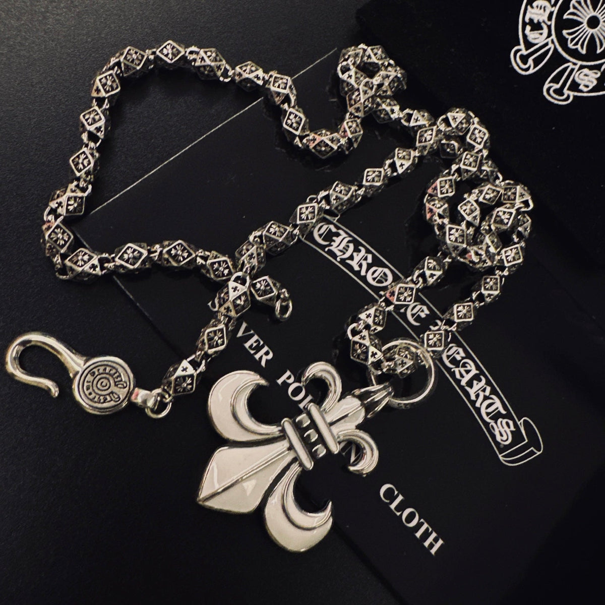 Martin Graham pendant necklace in polished metal-tone – close-up detail