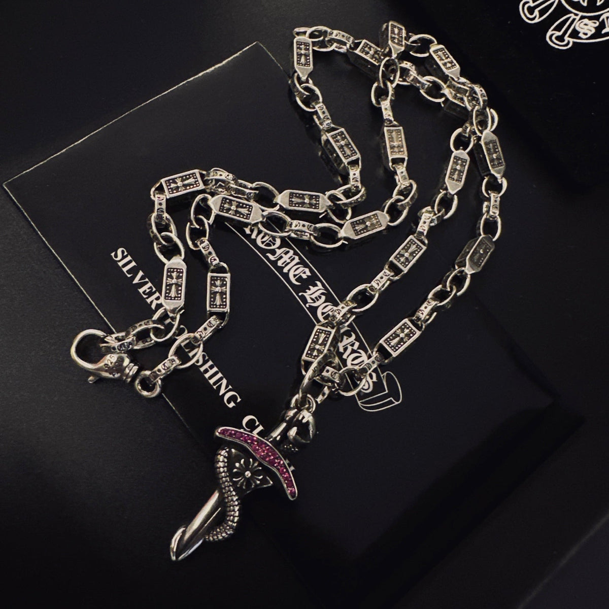 Martin Graham pendant necklace in polished metal-tone – close-up detail