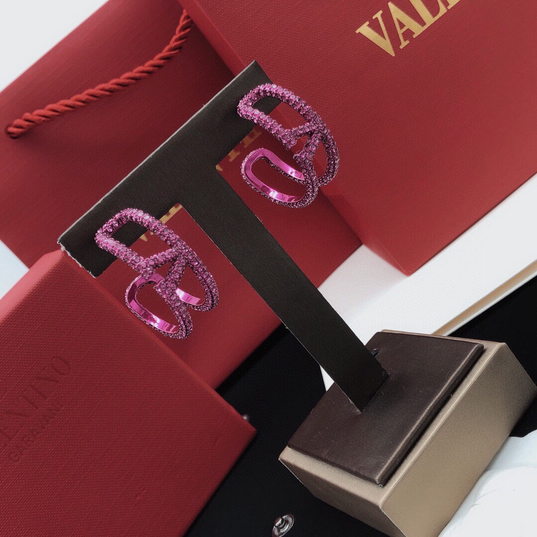 Martin Graham earrings in polished metal-tone