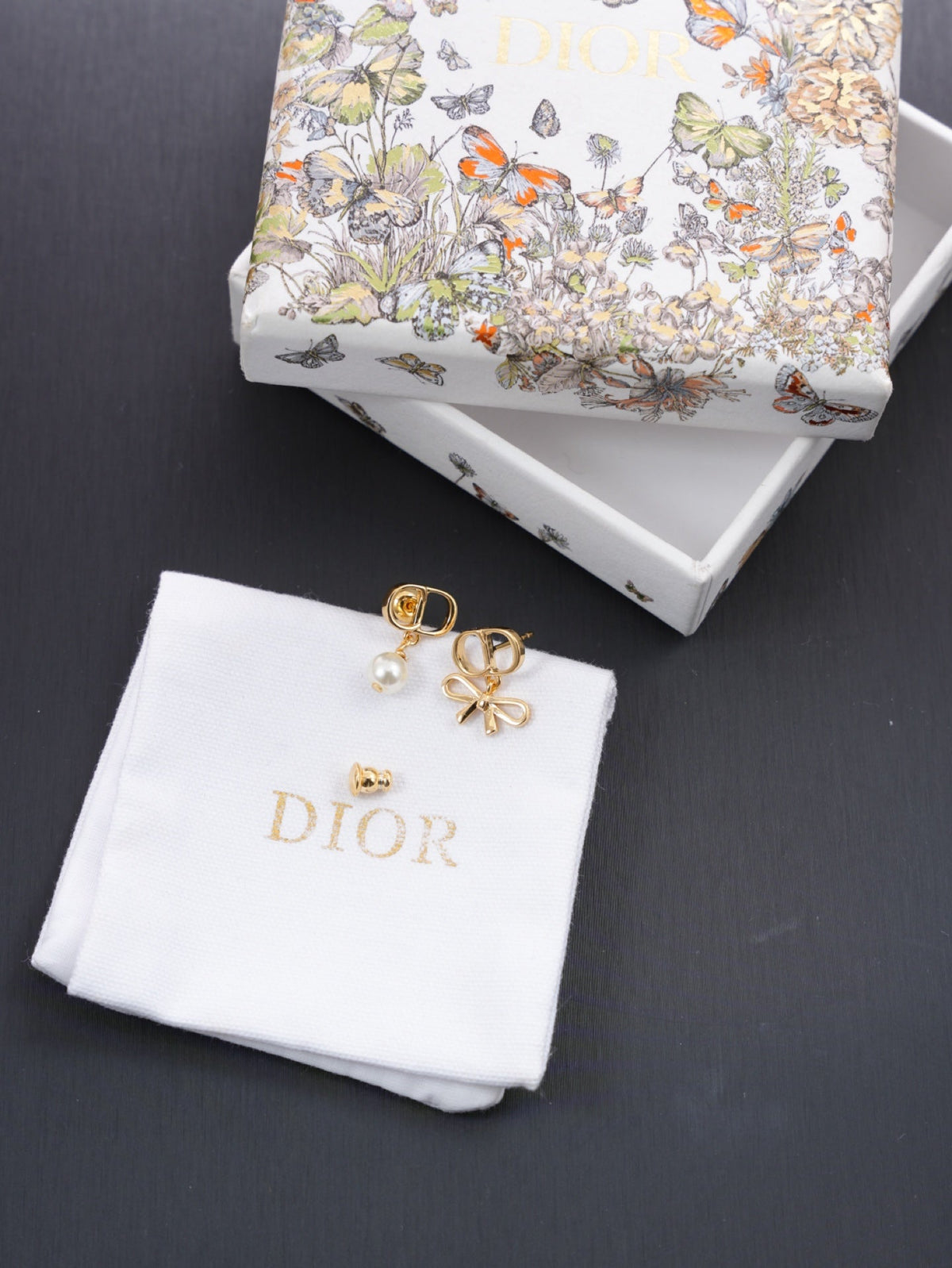 Martin Graham earrings in polished metal-tone