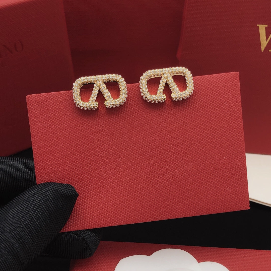 Martin Graham stud earrings in polished metal-tone