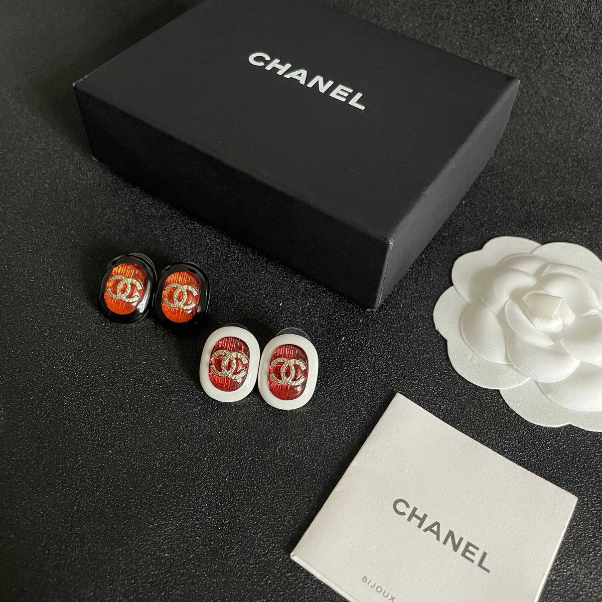 Martin Graham stud earrings in polished metal-tone – close-up detail