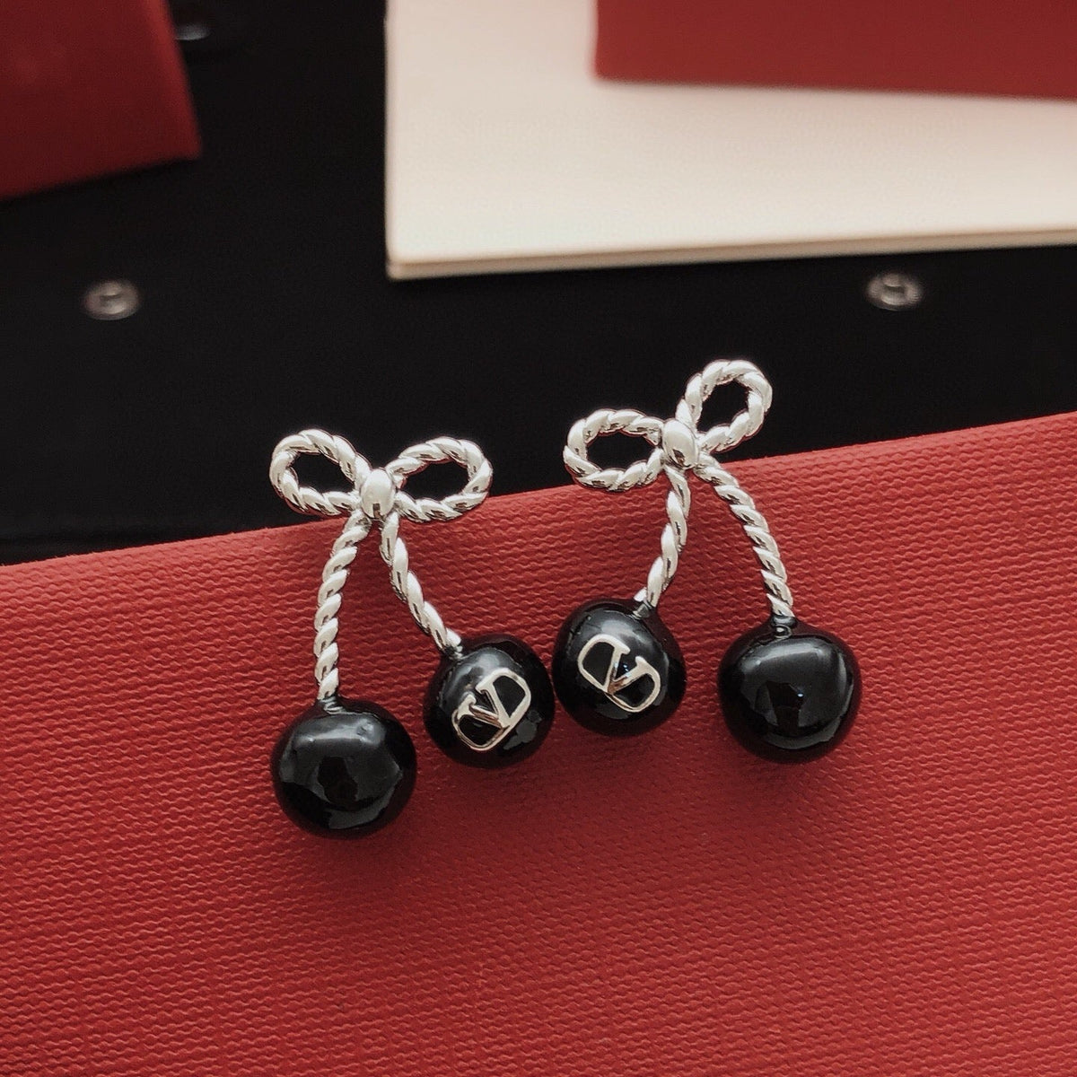 Martin Graham stud earrings in polished metal-tone