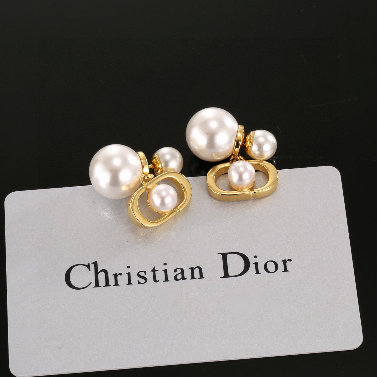 Martin Graham earrings in polished metal-tone