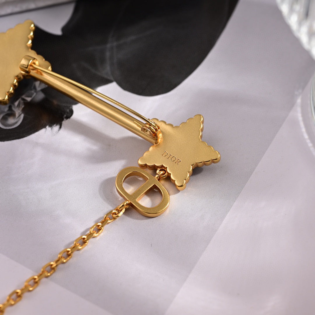 Martin Graham brooch in polished metal-tone