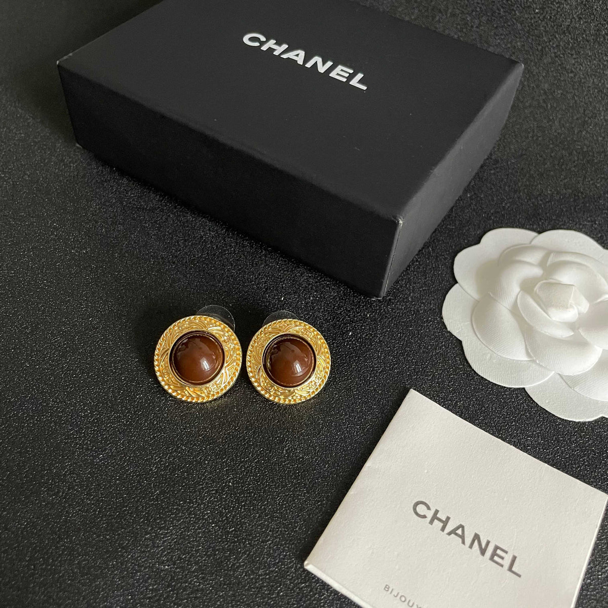 Martin Graham stud earrings in polished metal-tone – close-up detail