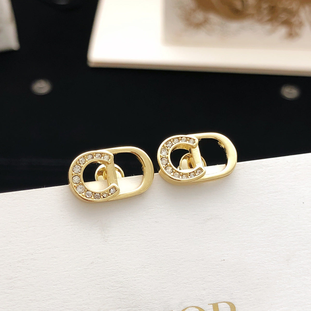 Martin Graham stud earrings in polished metal-tone