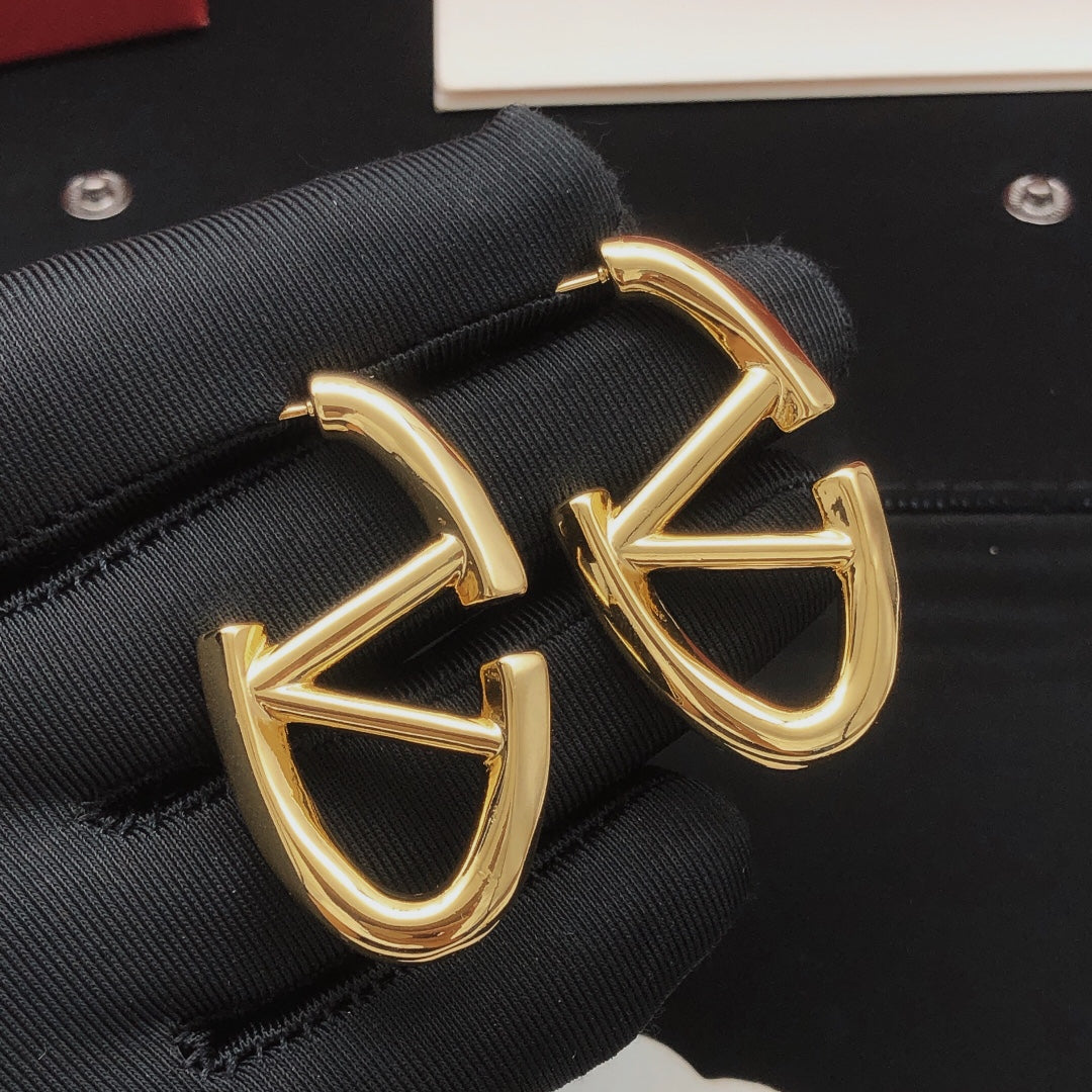 Martin Graham drop earrings in polished metal-tone