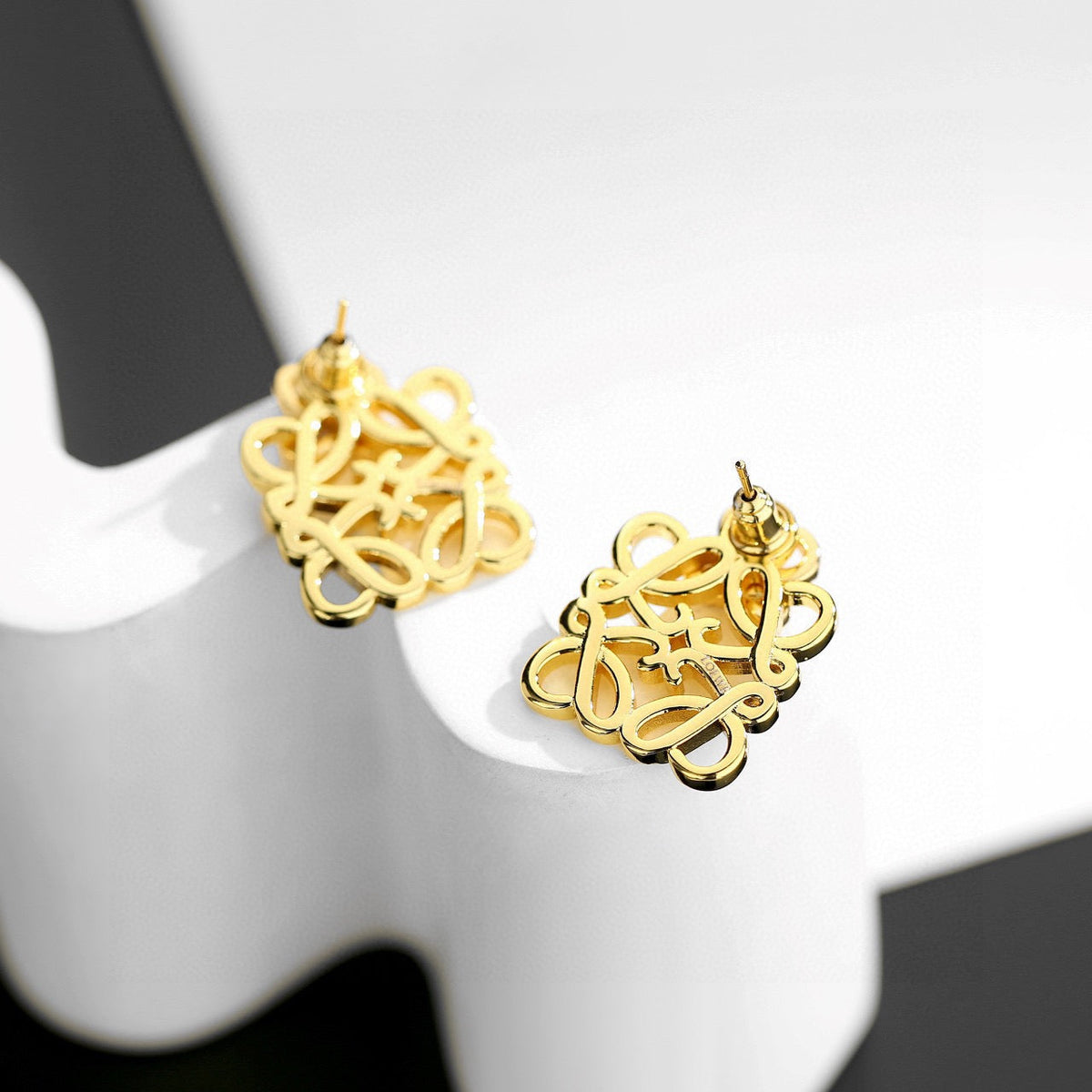 Martin Graham stud earrings in polished metal-tone