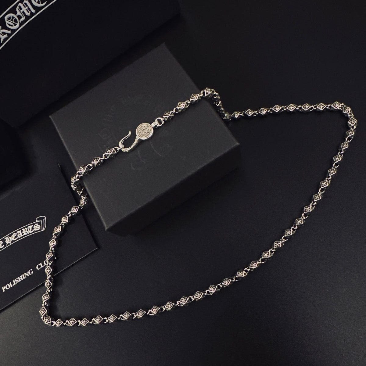 Martin Graham pendant necklace in polished metal-tone – close-up detail
