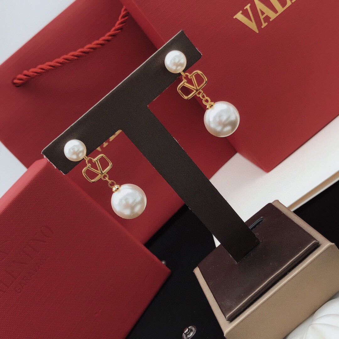 Martin Graham stud earrings in polished metal-tone