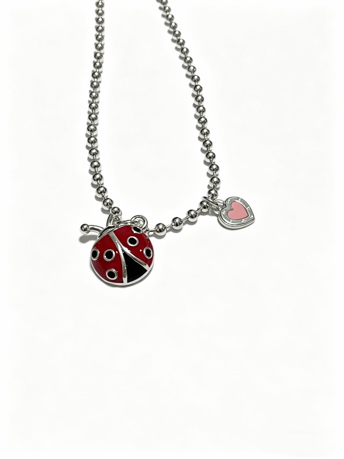 Martin Graham pendant necklace in polished metal-tone – close-up detail