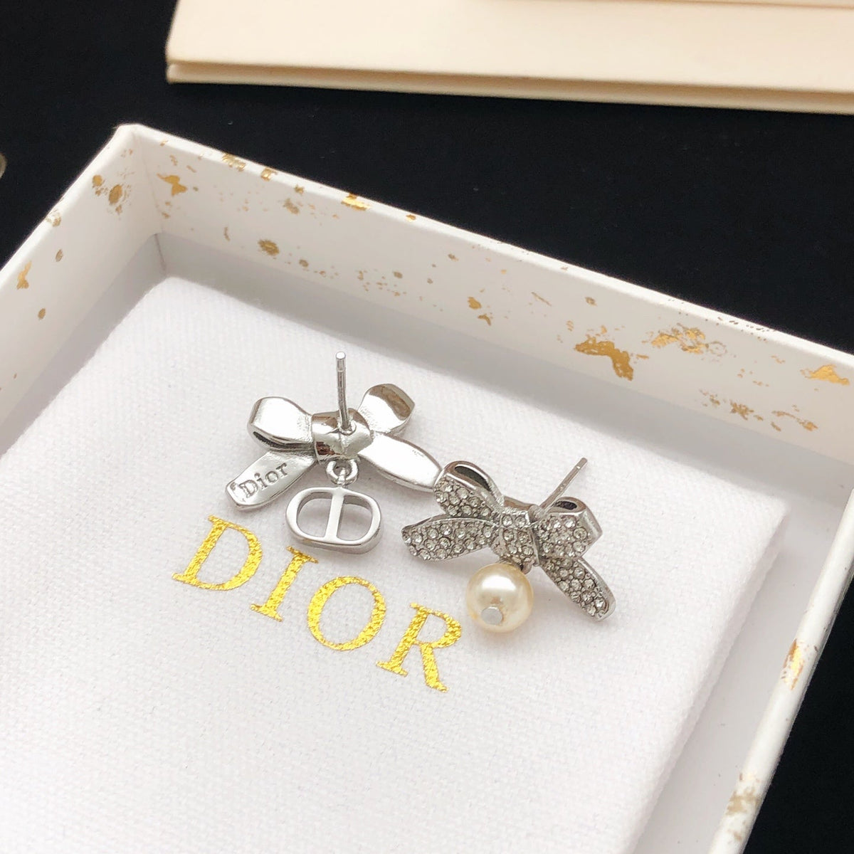 Martin Graham stud earrings in polished metal-tone