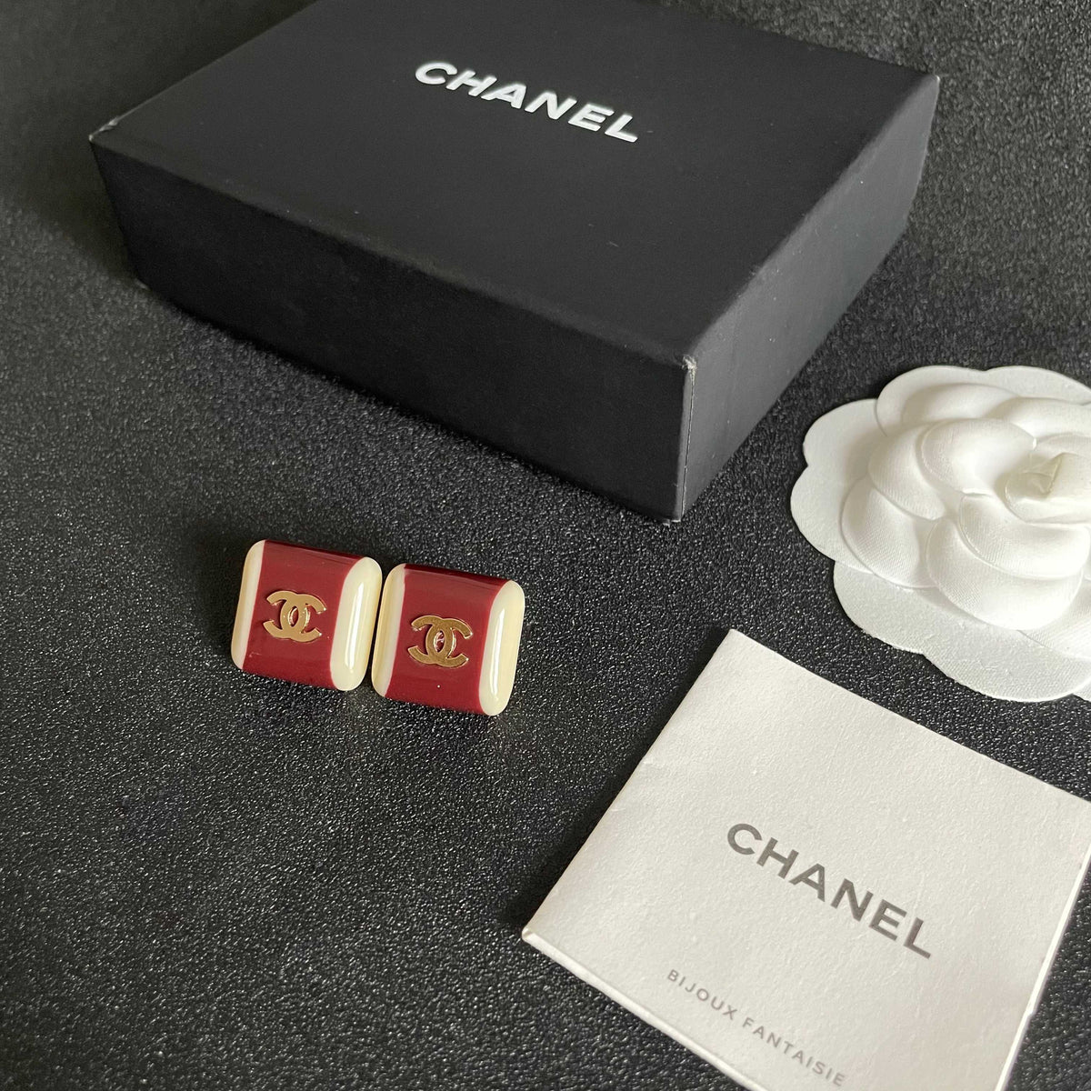 Martin Graham stud earrings in polished metal-tone – close-up detail