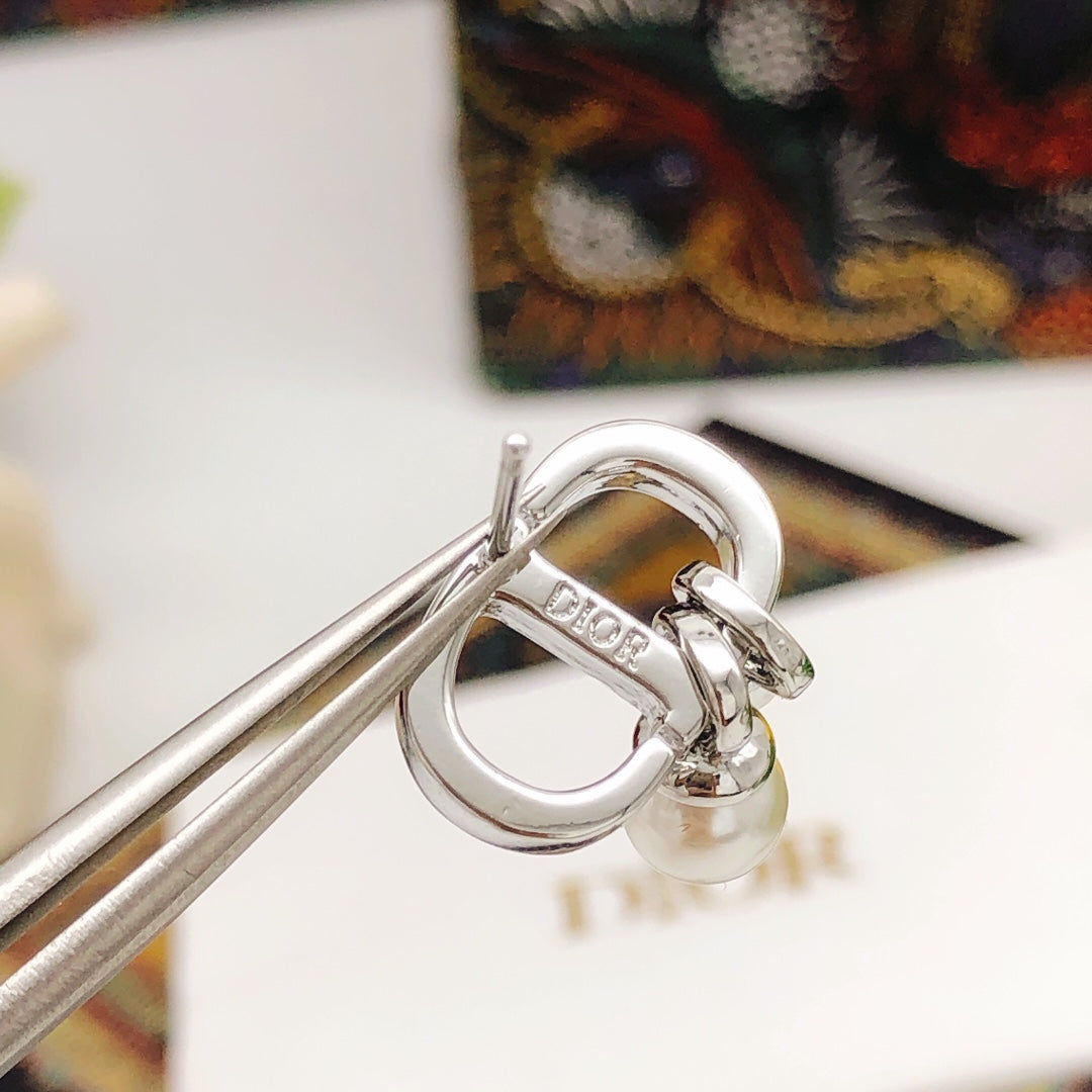 Martin Graham stud earrings in polished metal-tone
