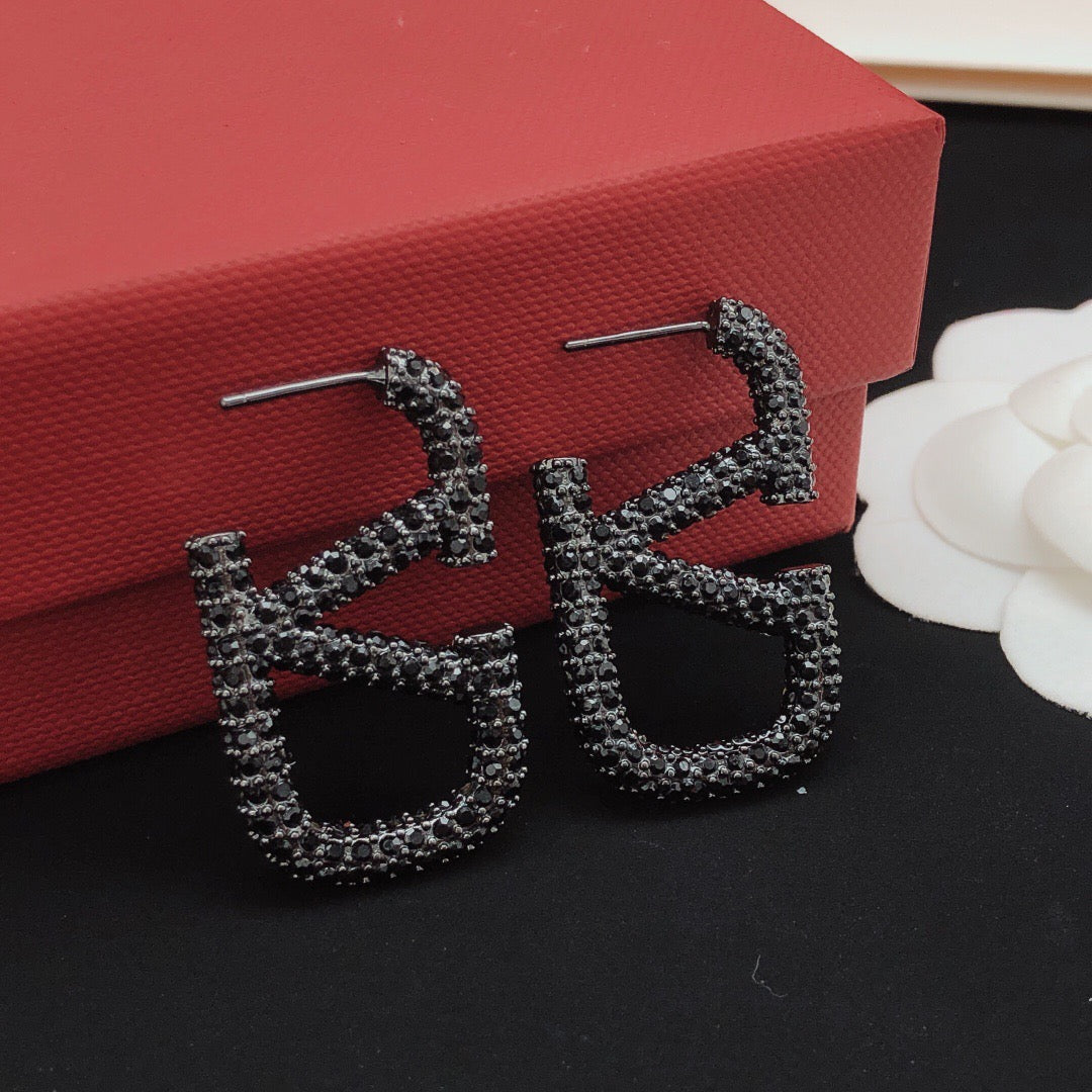 Martin Graham stud earrings in polished metal-tone