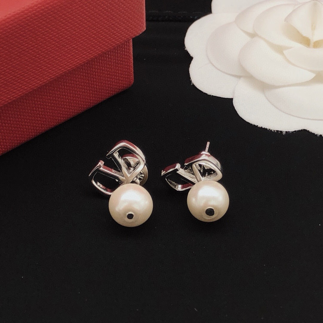 Martin Graham stud earrings in polished metal-tone
