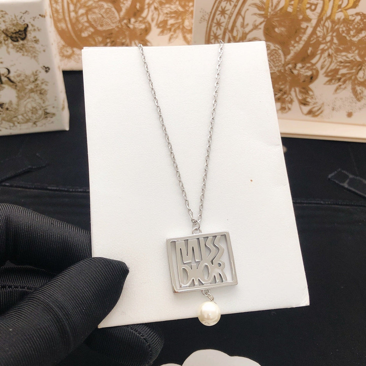 Martin Graham pendant necklace in polished metal-tone