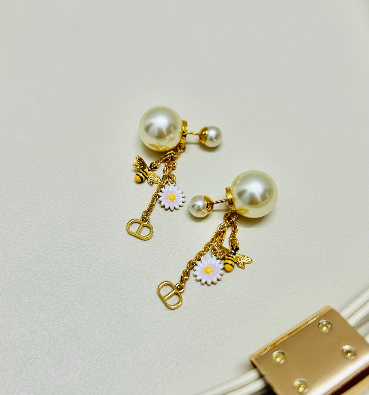 Martin Graham earrings in polished metal-tone