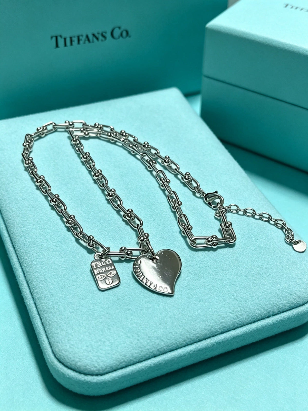 Martin Graham pendant necklace in polished metal-tone – close-up detail