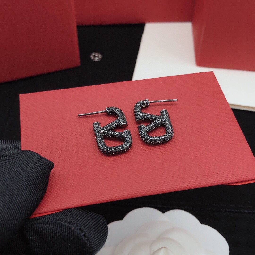 Martin Graham stud earrings in polished metal-tone