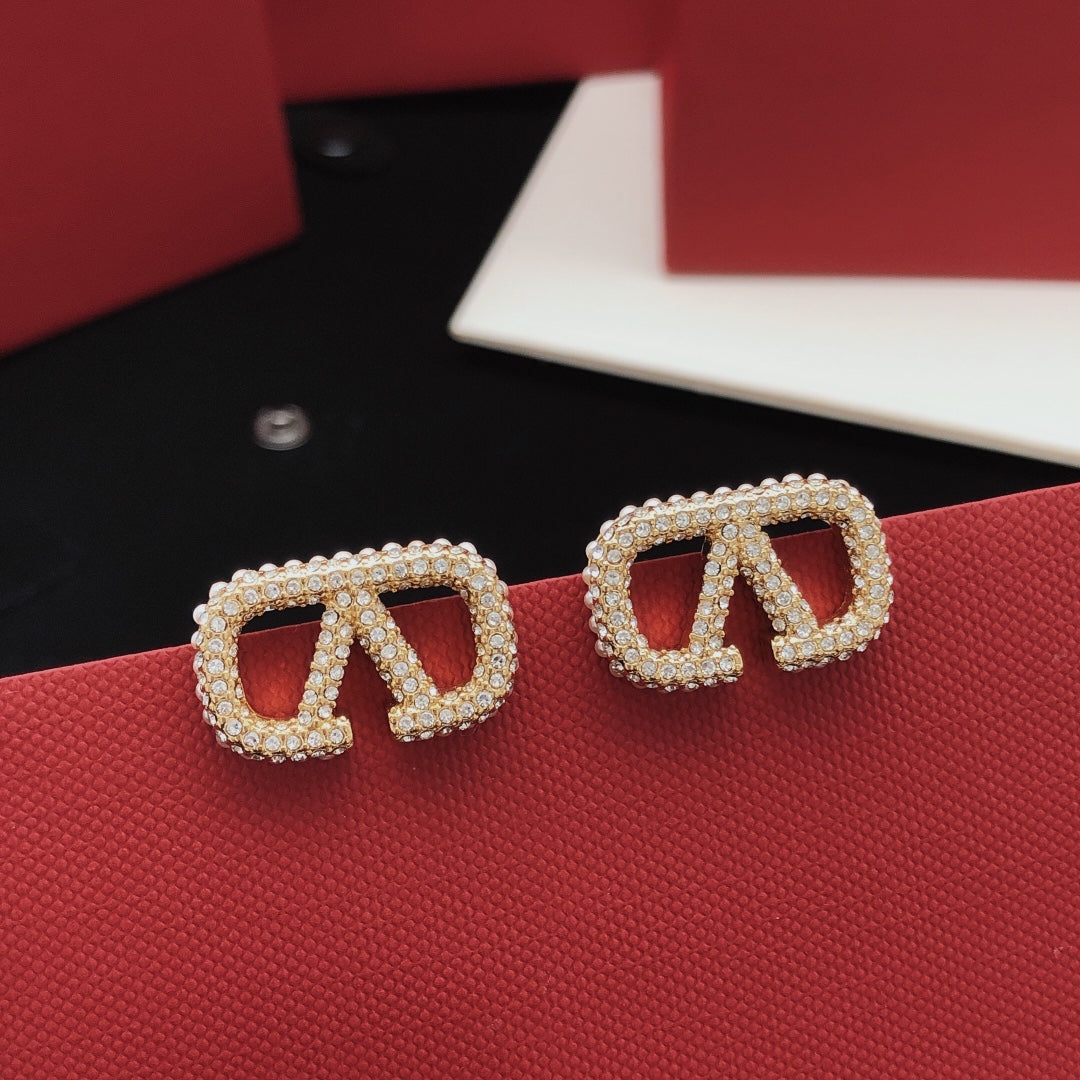 Martin Graham stud earrings in polished metal-tone