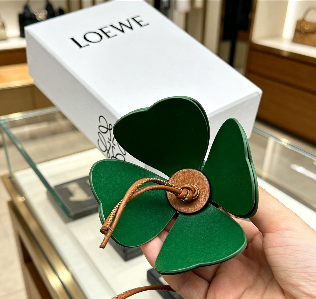 Martin Graham bag charm in polished metal-tone – close-up detail