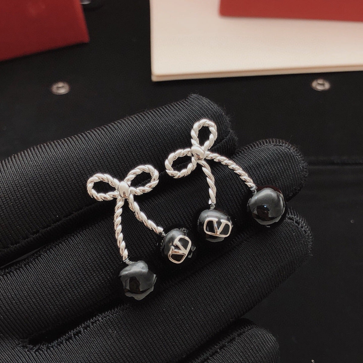 Martin Graham stud earrings in polished metal-tone