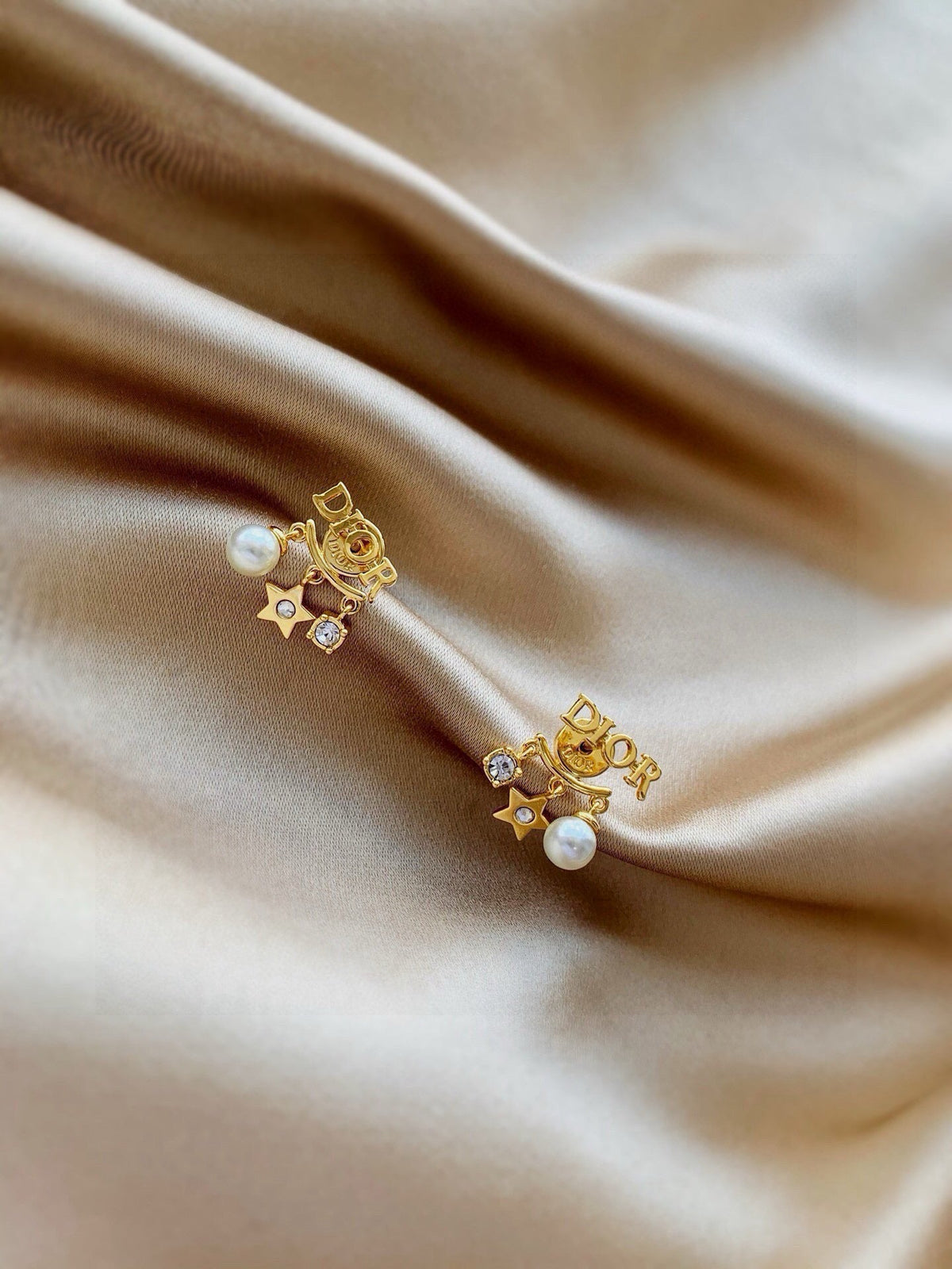 Martin Graham earrings in polished metal-tone – close-up detail