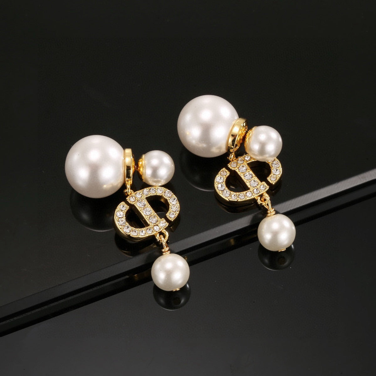 Martin Graham earrings in polished metal-tone – close-up detail