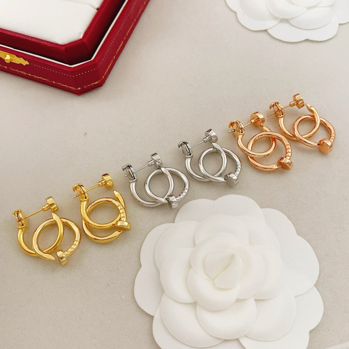 Martin Graham earrings in polished metal-tone – close-up detail