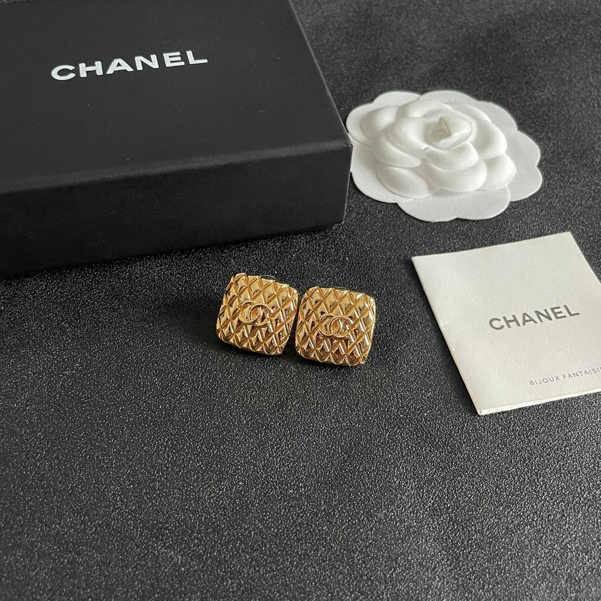 Martin Graham stud earrings in polished metal-tone – styled product view