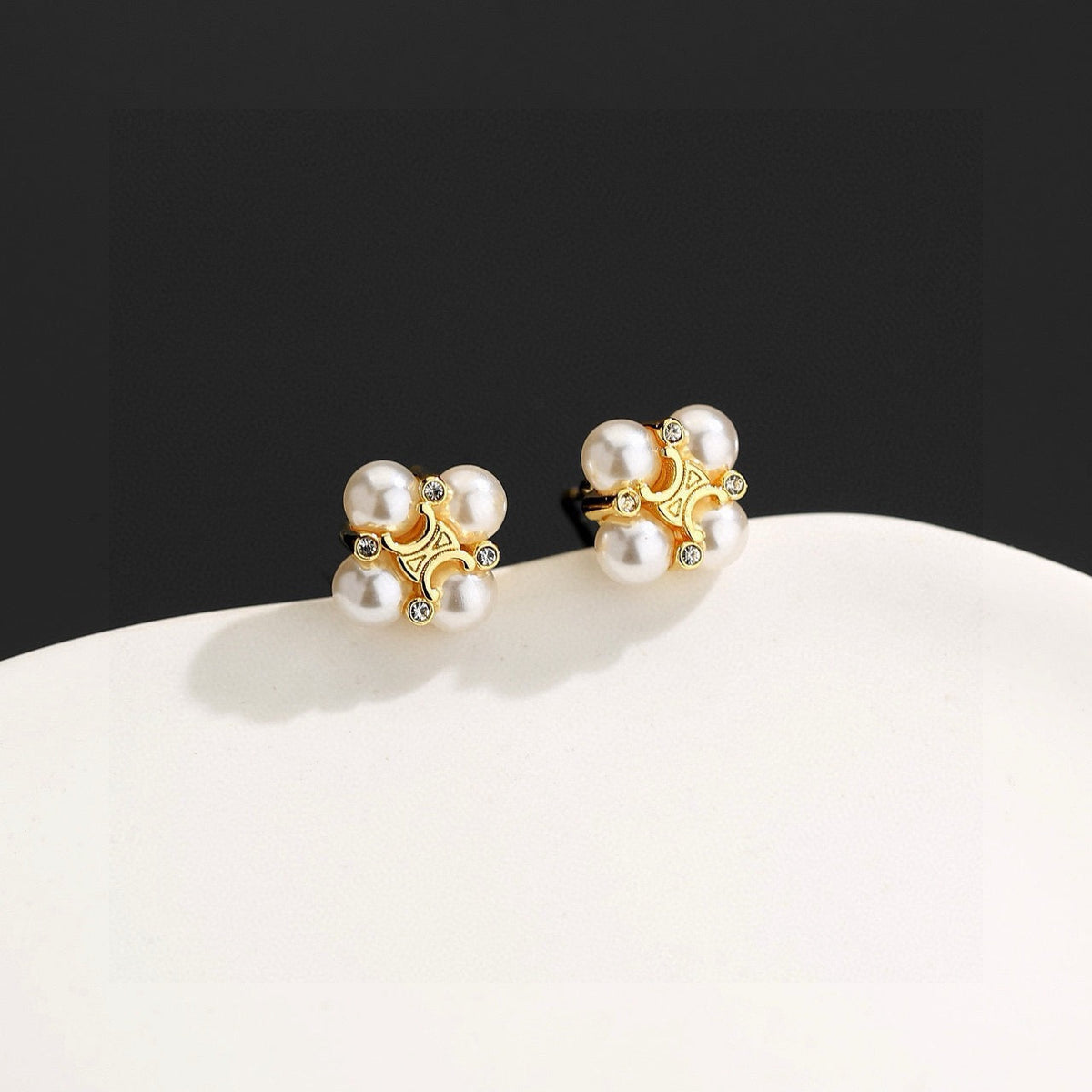 Martin Graham stud earrings in polished metal-tone