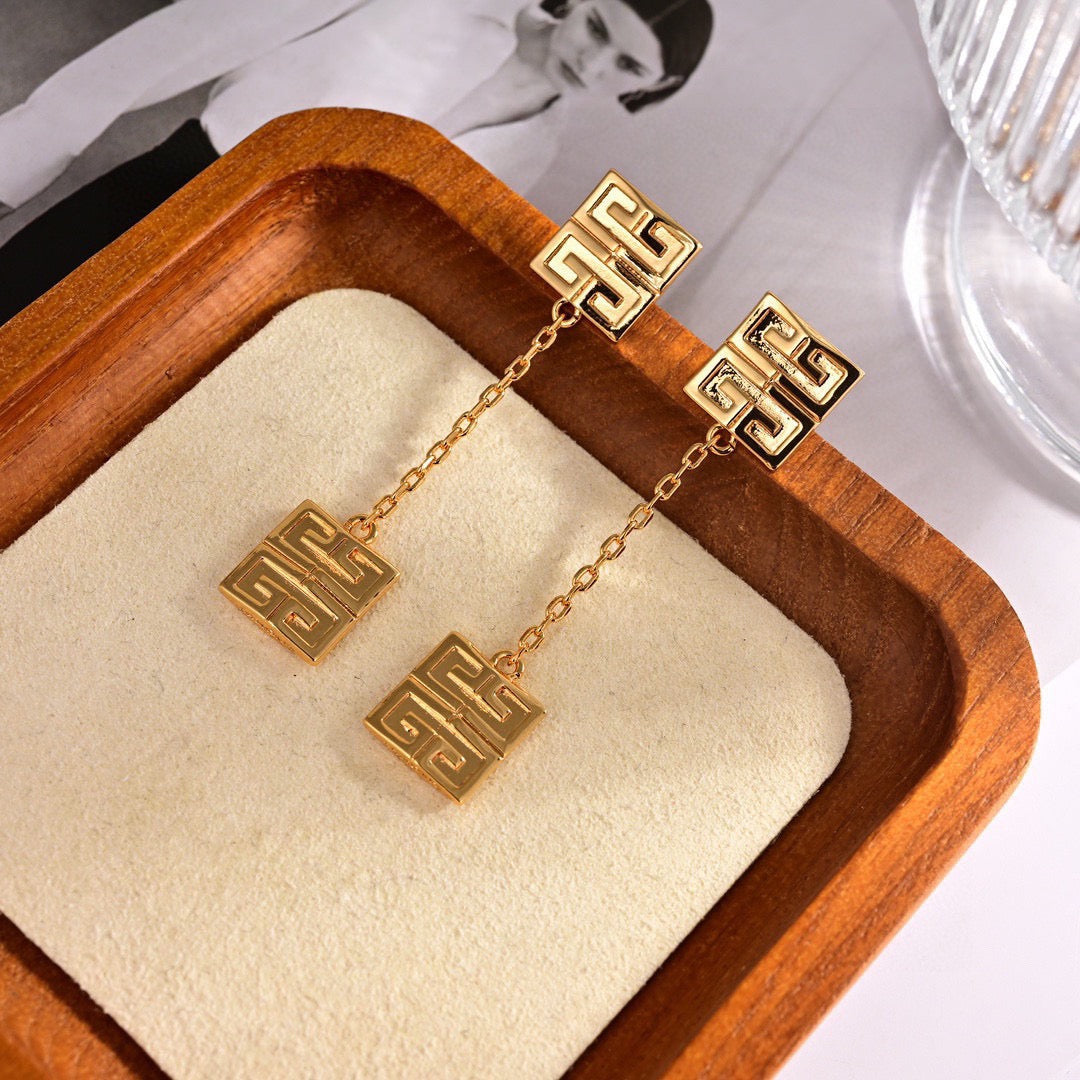 Martin Graham stud earrings in polished metal-tone