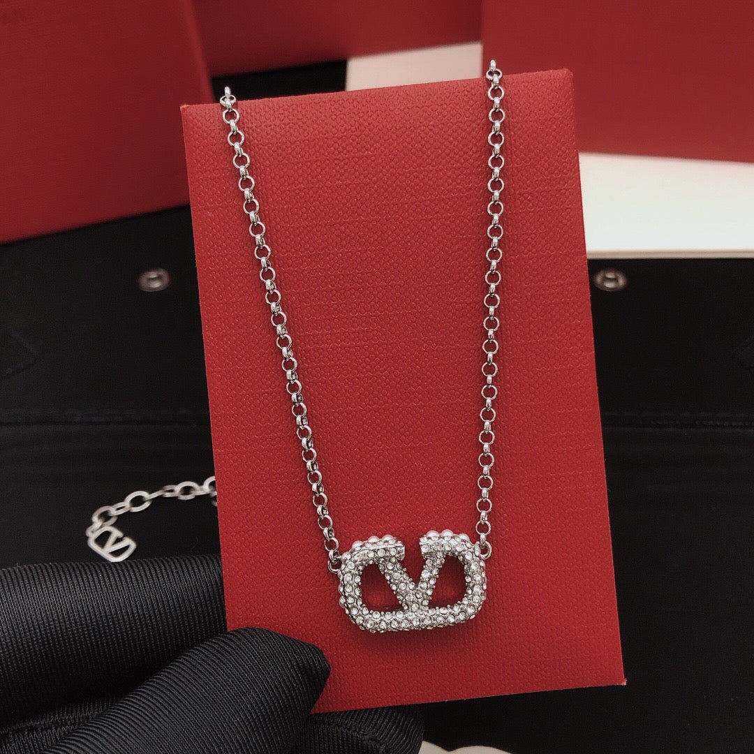 Martin Graham pendant necklace in polished metal-tone