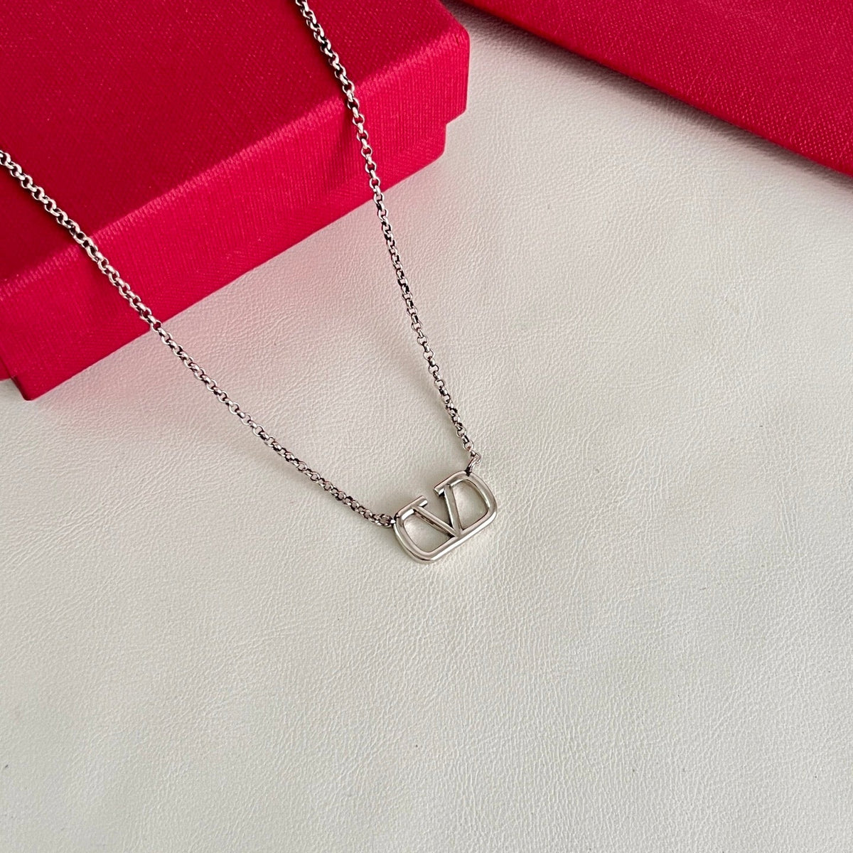 Martin Graham pendant necklace in polished metal-tone