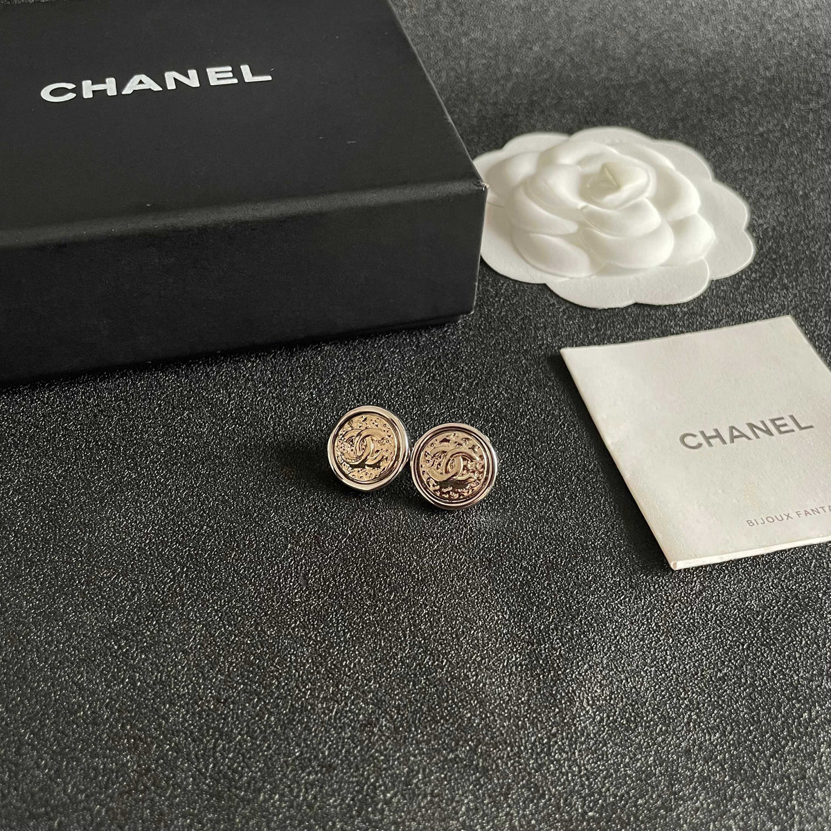 Martin Graham stud earrings in polished metal-tone – styled product view