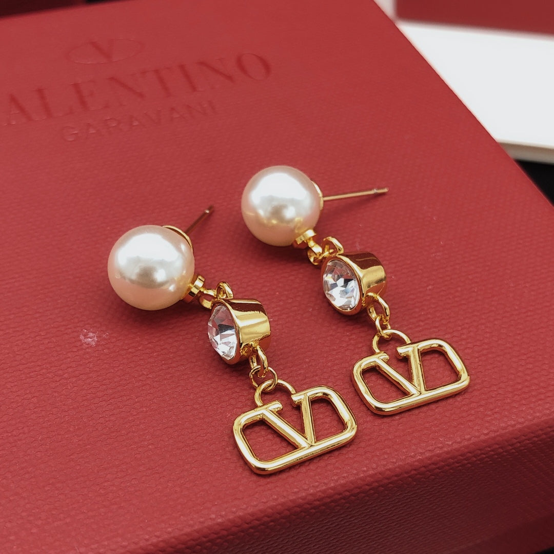 Martin Graham stud earrings in polished metal-tone