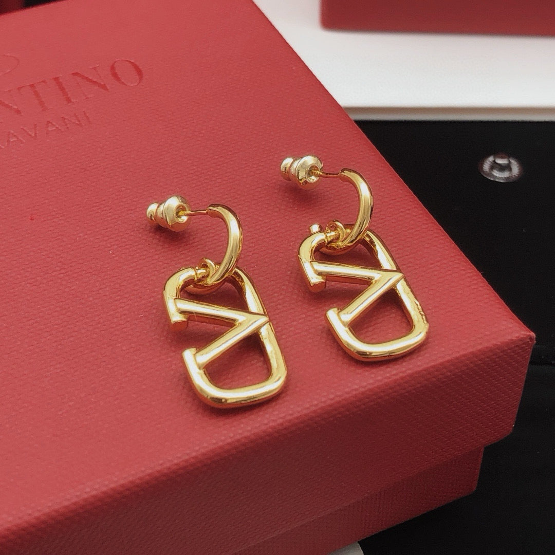 Martin Graham drop earrings in polished metal-tone