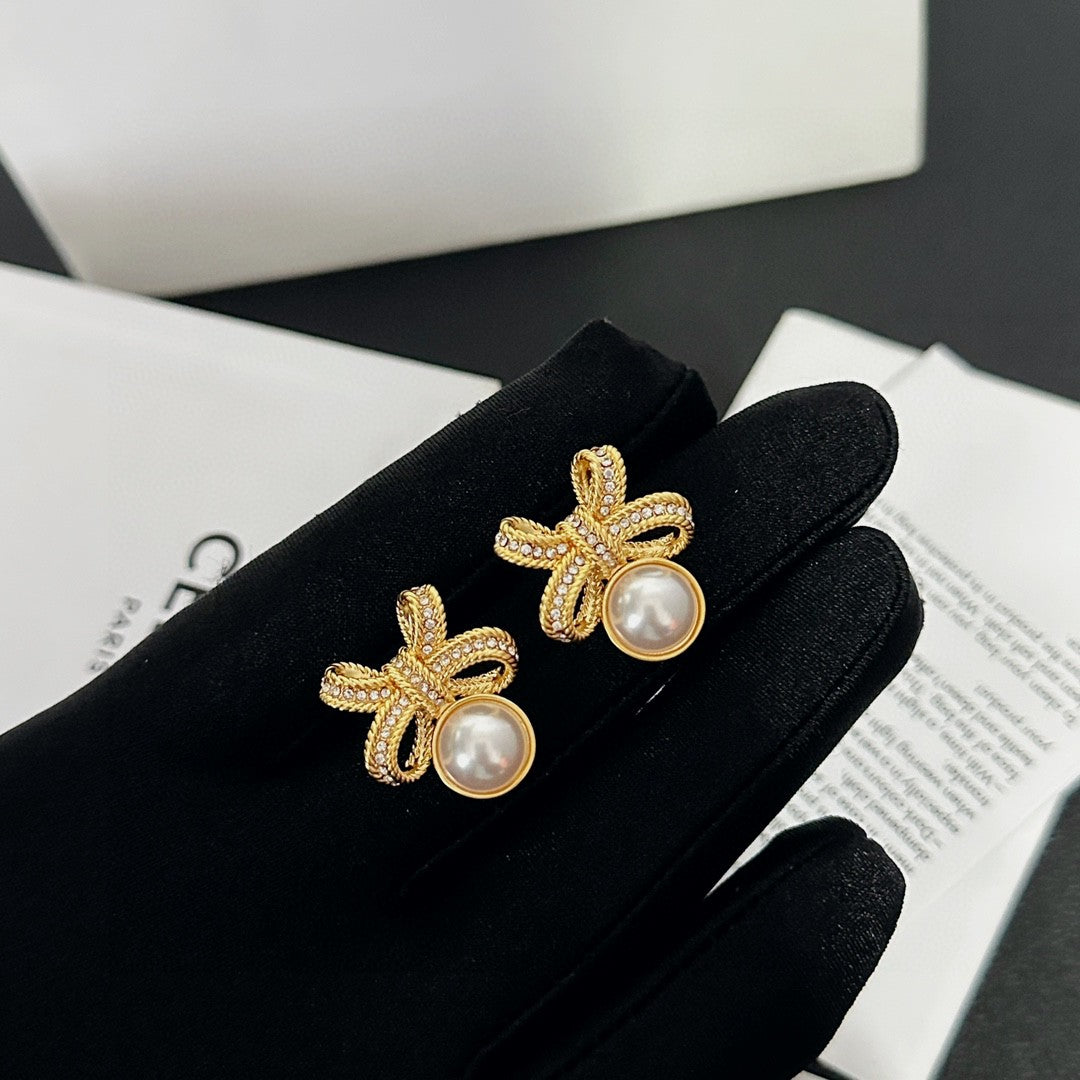 Martin Graham stud earrings in polished metal-tone