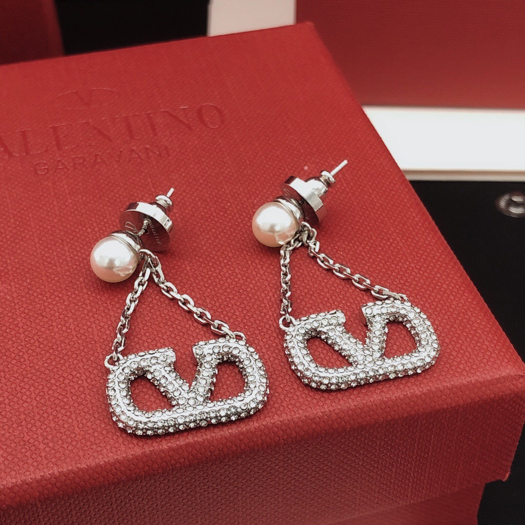 Martin Graham stud earrings in polished metal-tone
