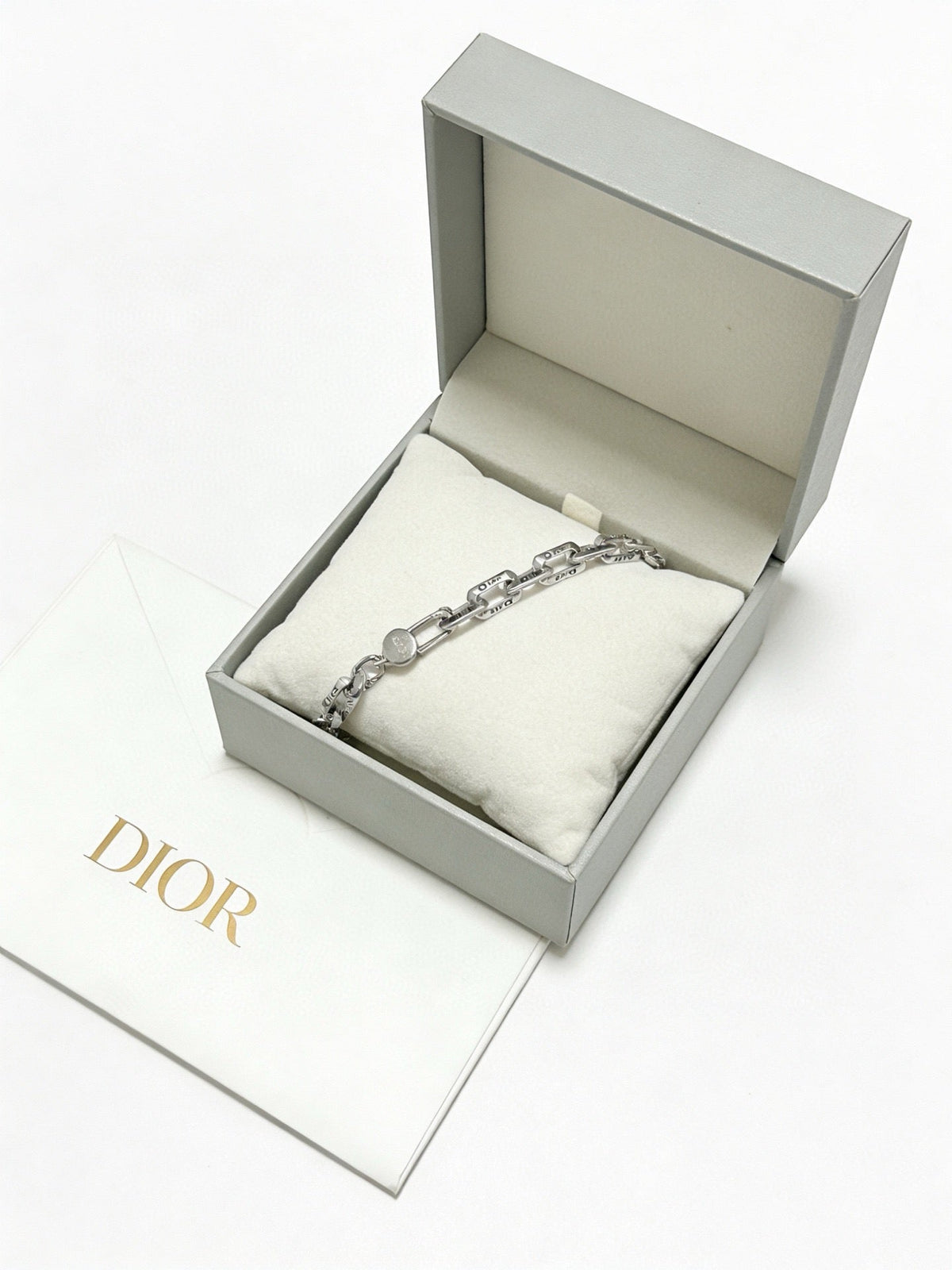 Martin Graham pendant necklace in polished metal-tone – close-up detail