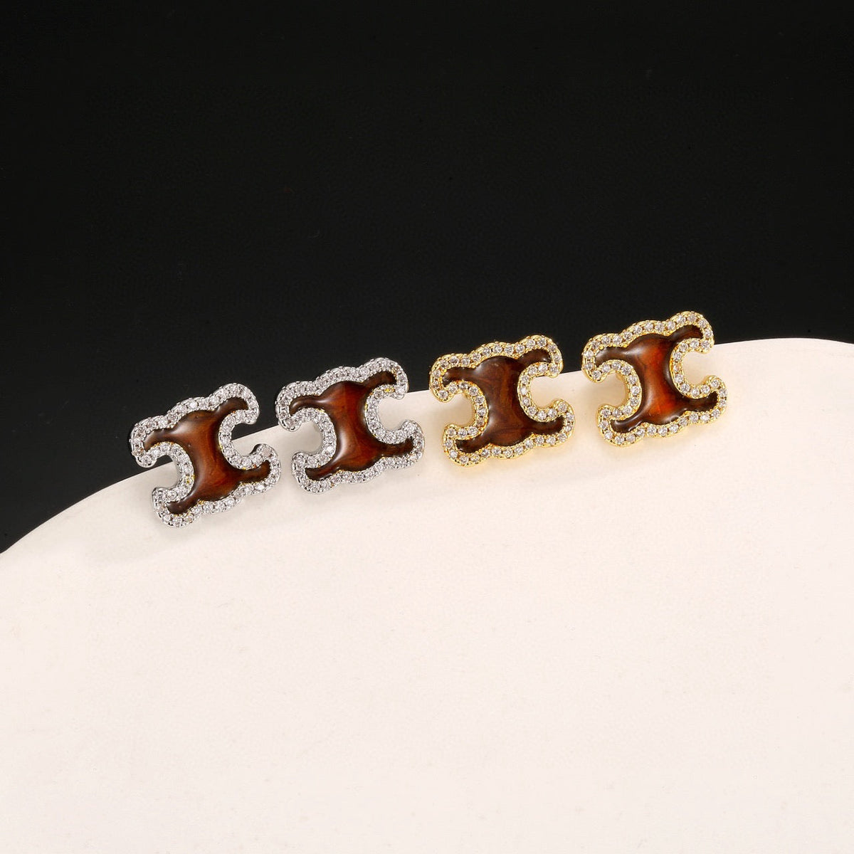 Martin Graham stud earrings in polished metal-tone