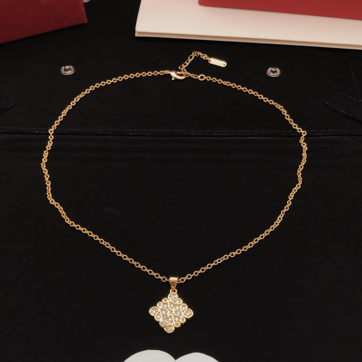 Martin Graham pendant necklace in polished metal-tone – close-up detail