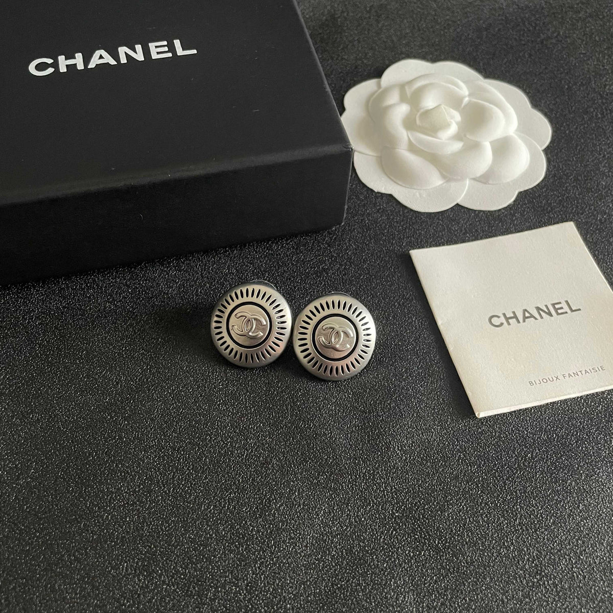 Martin Graham stud earrings in polished metal-tone – styled product view