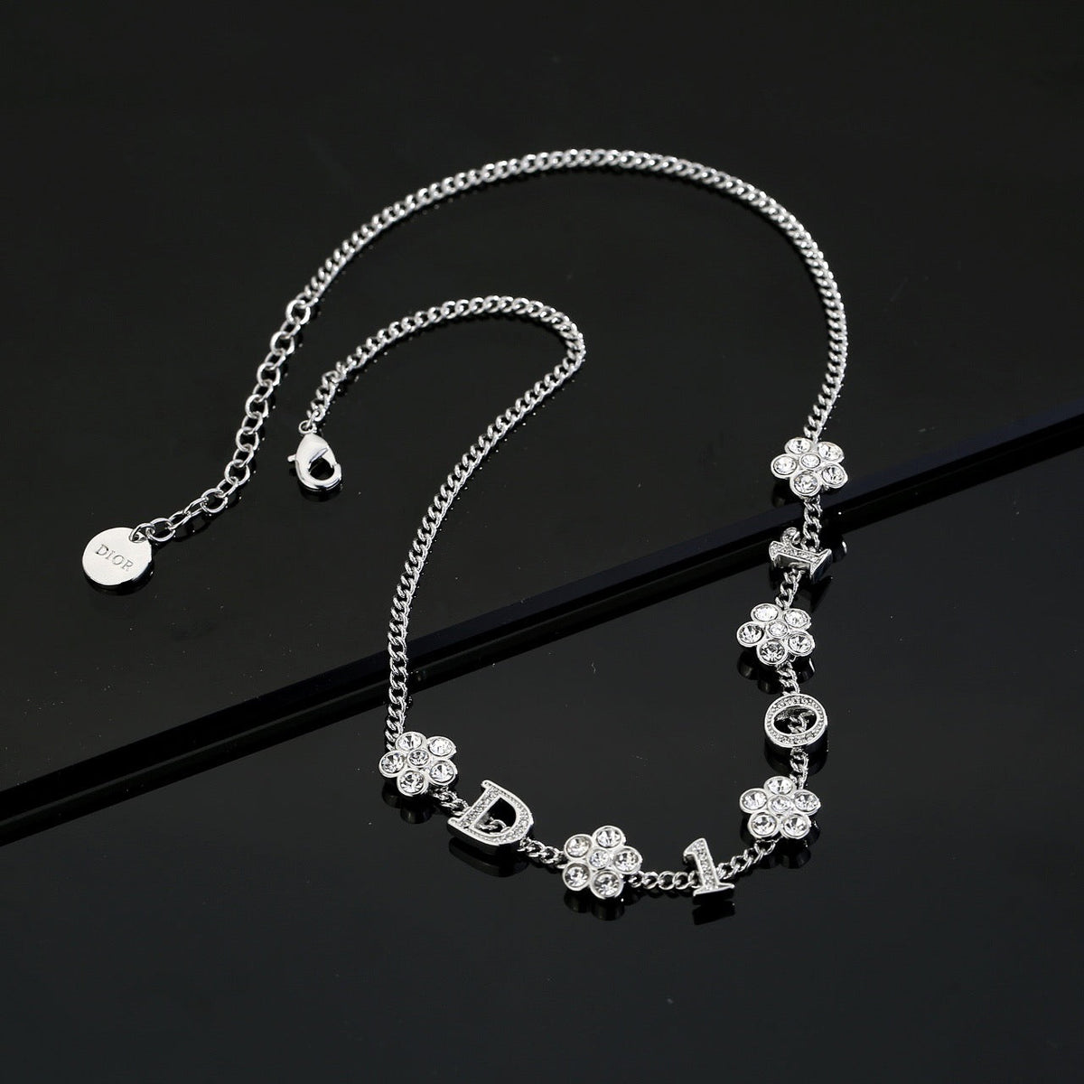 Martin Graham pendant necklace in polished metal-tone – close-up detail