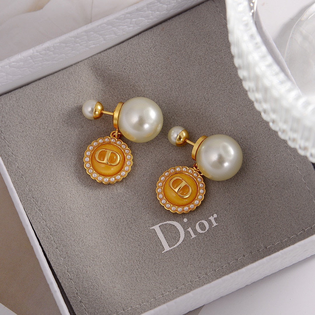 Martin Graham stud earrings in polished metal-tone – close-up detail