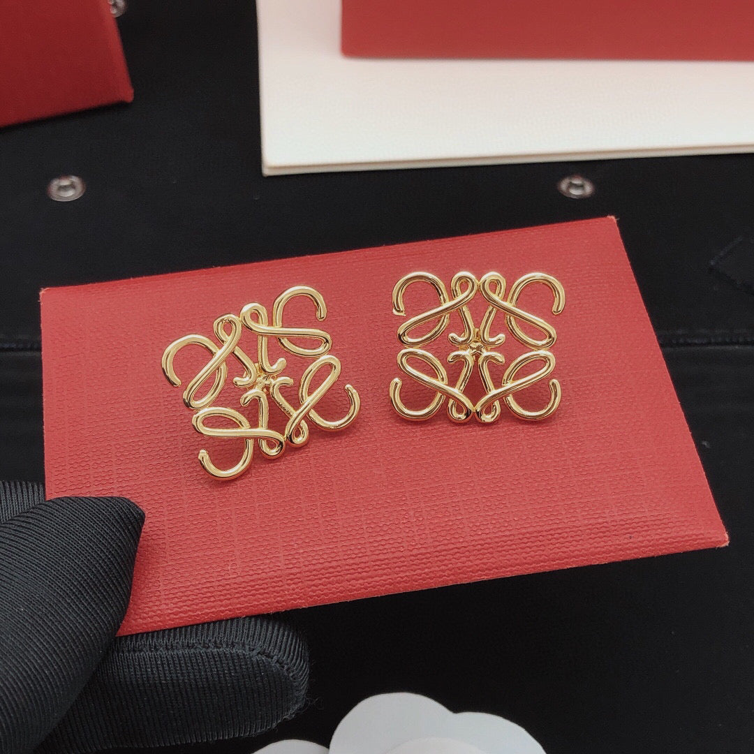 Martin Graham stud earrings in polished metal-tone – close-up detail