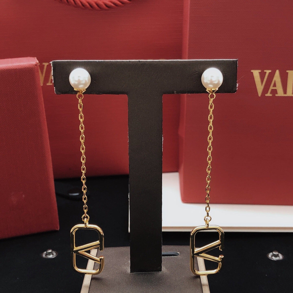 Martin Graham stud earrings in polished metal-tone
